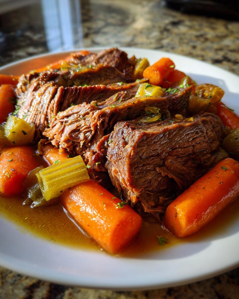 Slices of tender pot roast served with carrots and celery, perfect for Sunday dinner ideas.